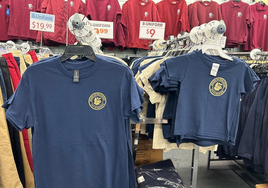 Navy Board of Education uniform t-shirts on display in the store
